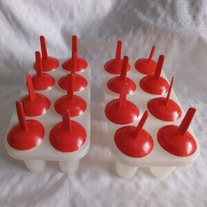 Two vintage plastic popsicle molds, perfect for making your own frozen treats.
